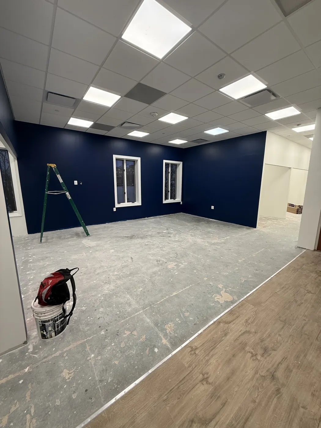Commercial interior with acoustical ceiling grid and painted walls