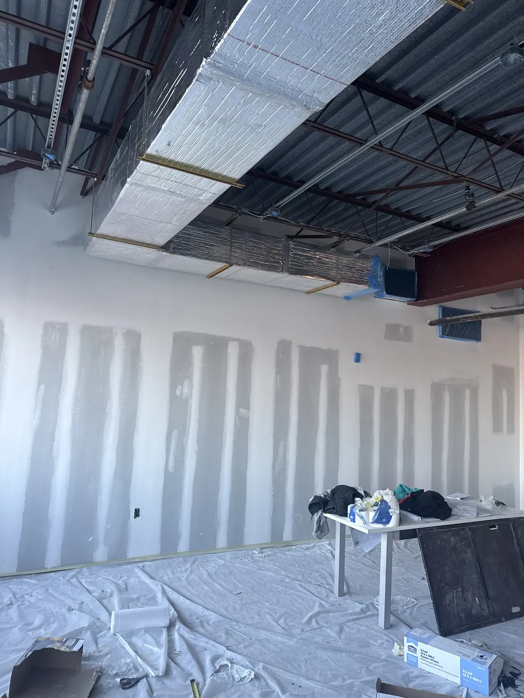 Commercial drywall installation and finishing in progress