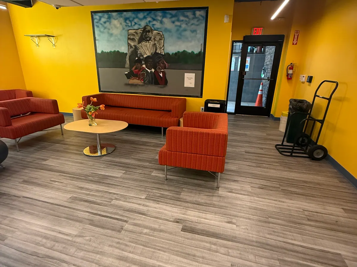 Customer-facing commercial lobby with seating and finished wall details