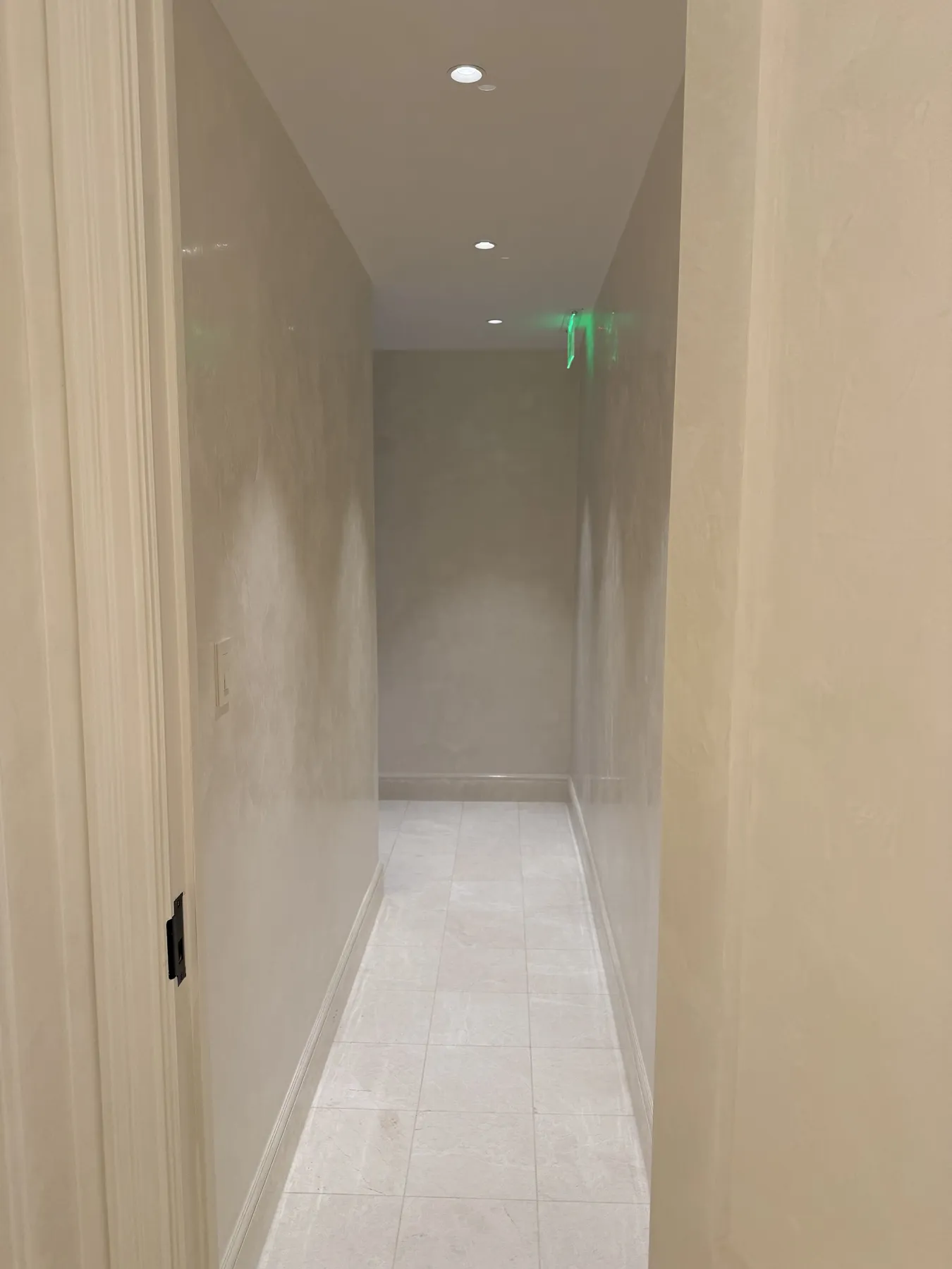 Finished interior opening with light wall surfaces and trim