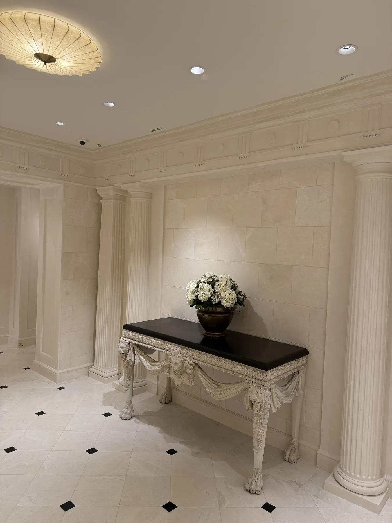 Detailed wall moulding and built-in console within a finished interior