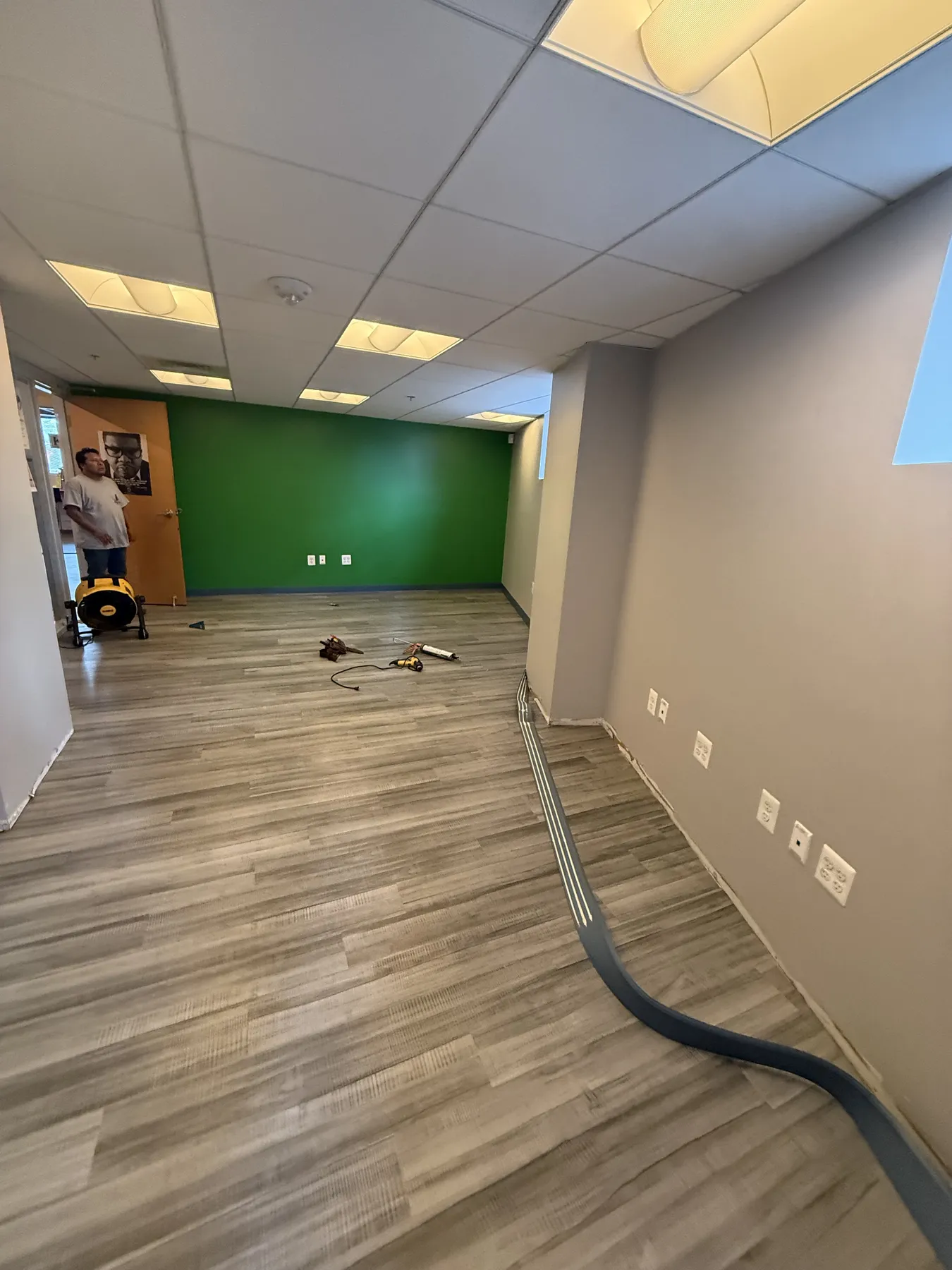 Completed workplace room with painted walls and finished flooring