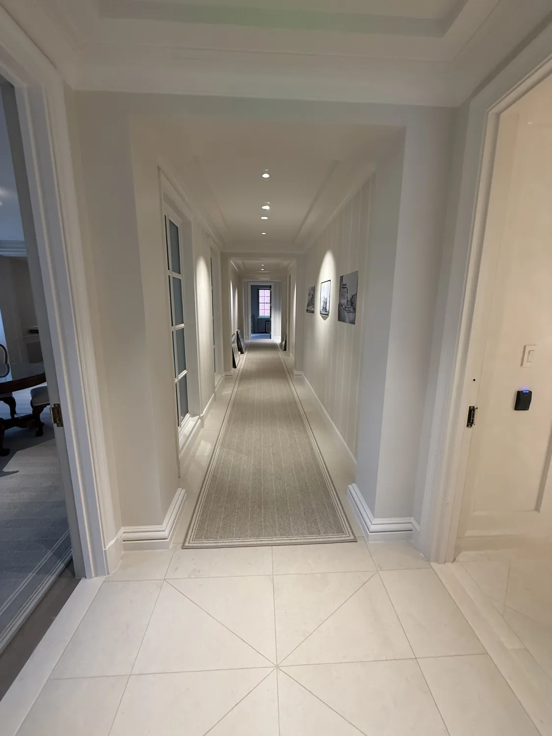 Finished corridor with detailed wall trim, casing, and aligned transitions
