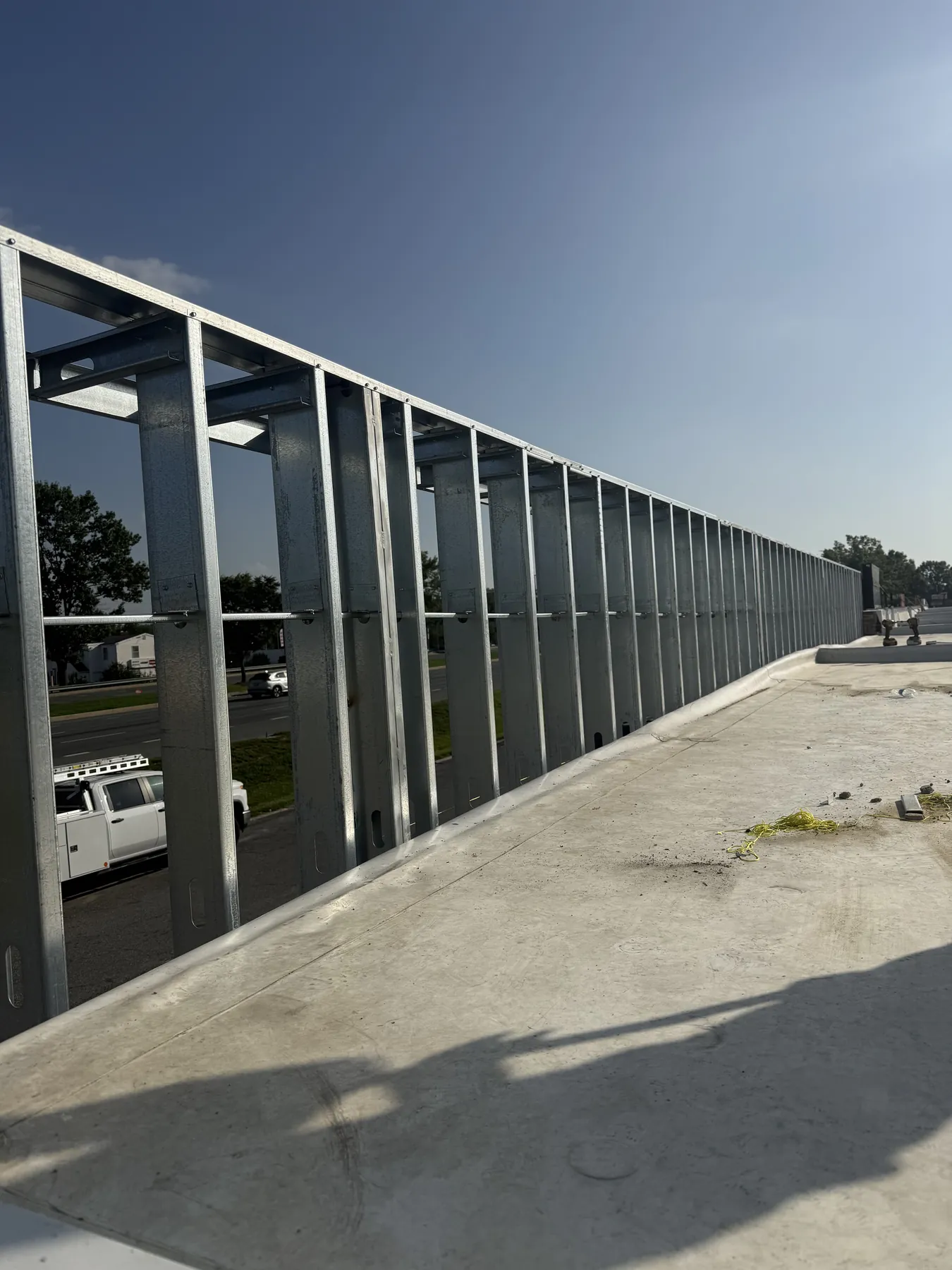 Long commercial metal framing run showing coordinated wall lines and openings
