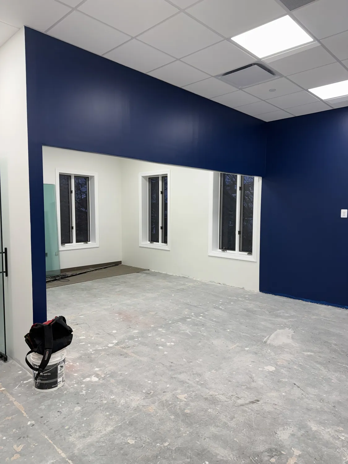 Commercial interior showing crisp paint transitions between blue and white wall surfaces