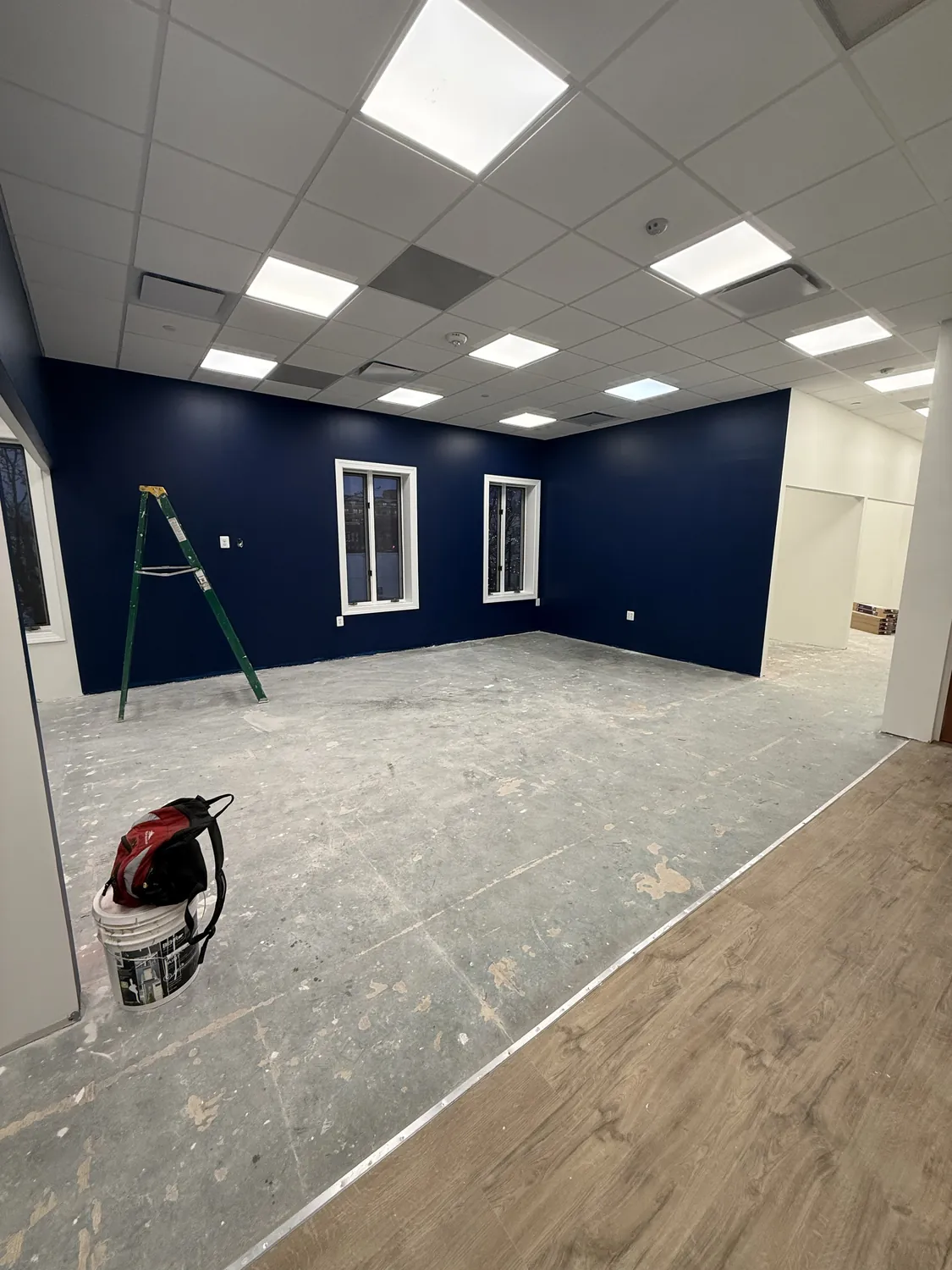 Commercial room with coordinated deep-blue painted walls and white trim